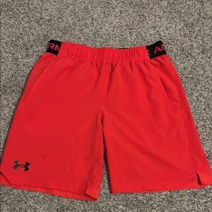 Under Armor boys size medium Red shorts. More of a bright coral red.